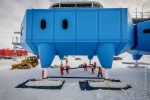 Installation of steel braces linking module's legs for towing